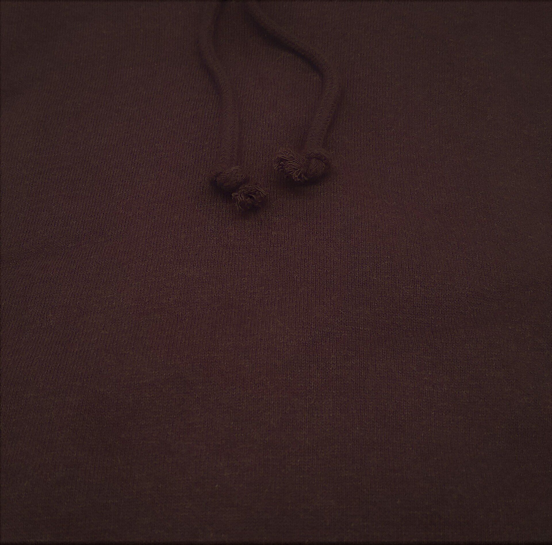 A close up of a green hemp hoodie with a hood.