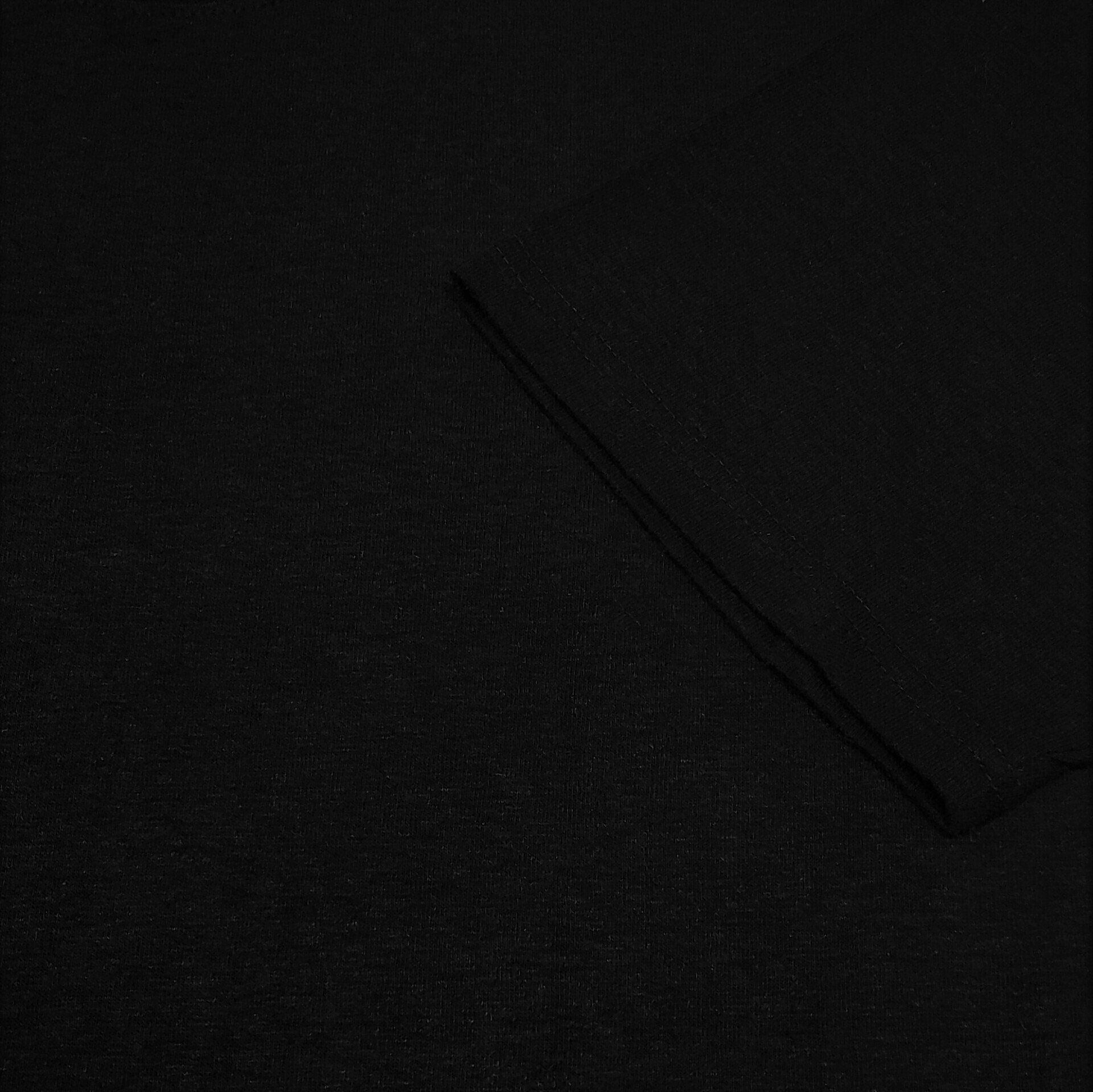 A close up of a piece of black fabric on a table.