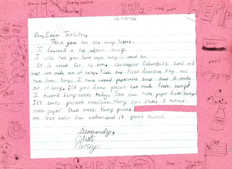 A letter is written on a piece of pink paper