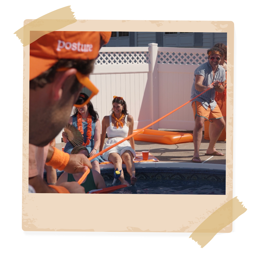 A man wearing an orange hat that says postur on it