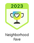 Neighborhood Fave award badge, 2023. Trophy with heart symbol, green and gold colors.