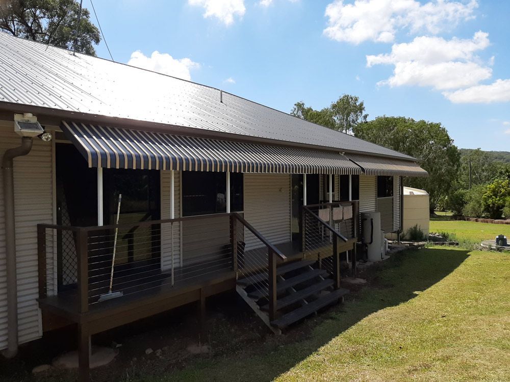 Residential House with Wood Decking and Awning