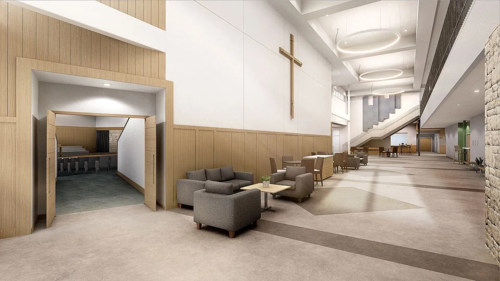 A church interior with seating area, wooden accents, a cross, and a staircase.