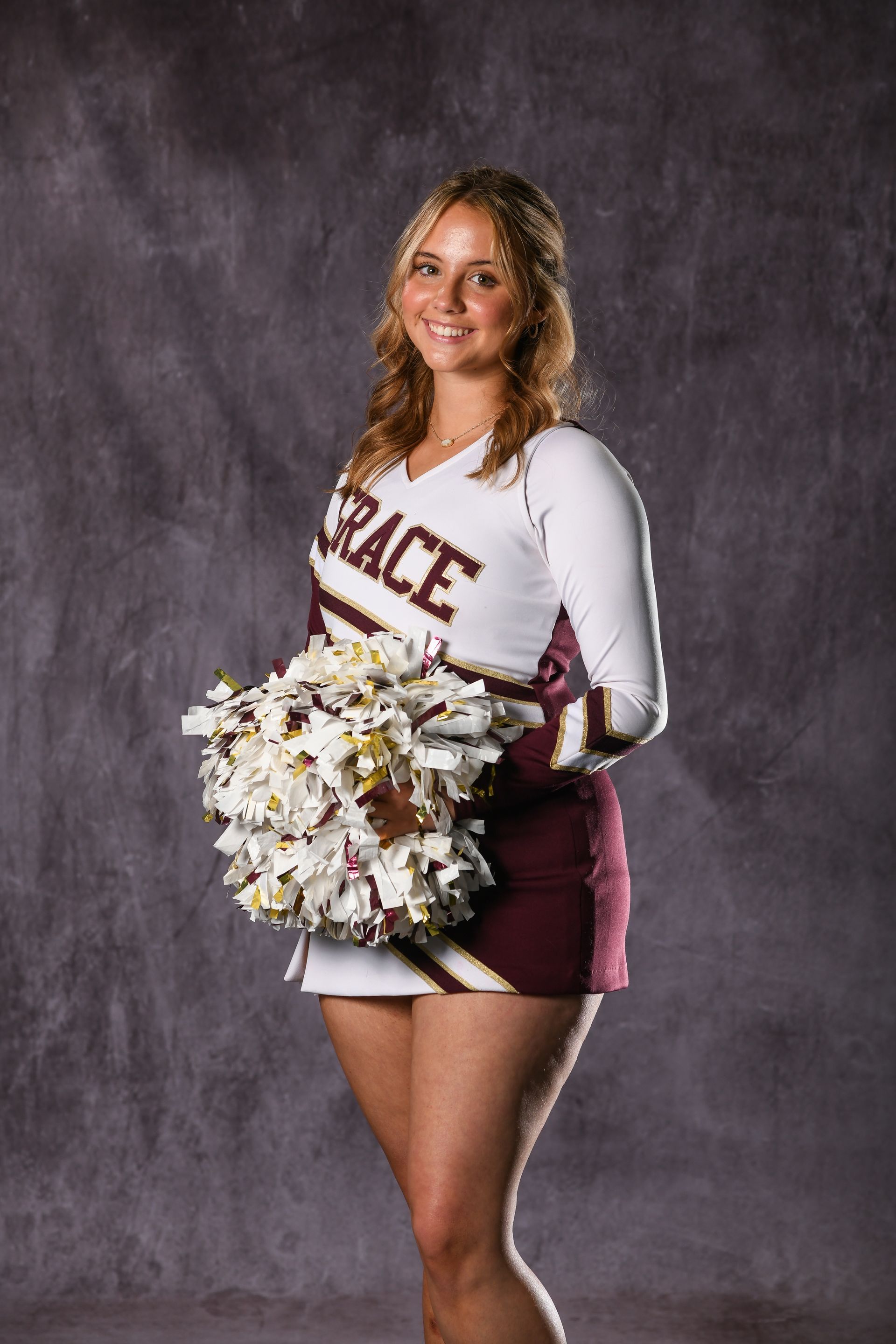 Eagle head logo in maroon and gold.