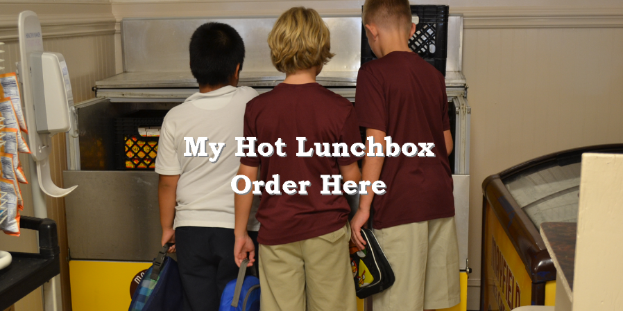 Three students ordering lunch at a school cafeteria, in front of a hot lunch counter.