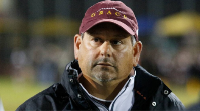 Man wearing a maroon