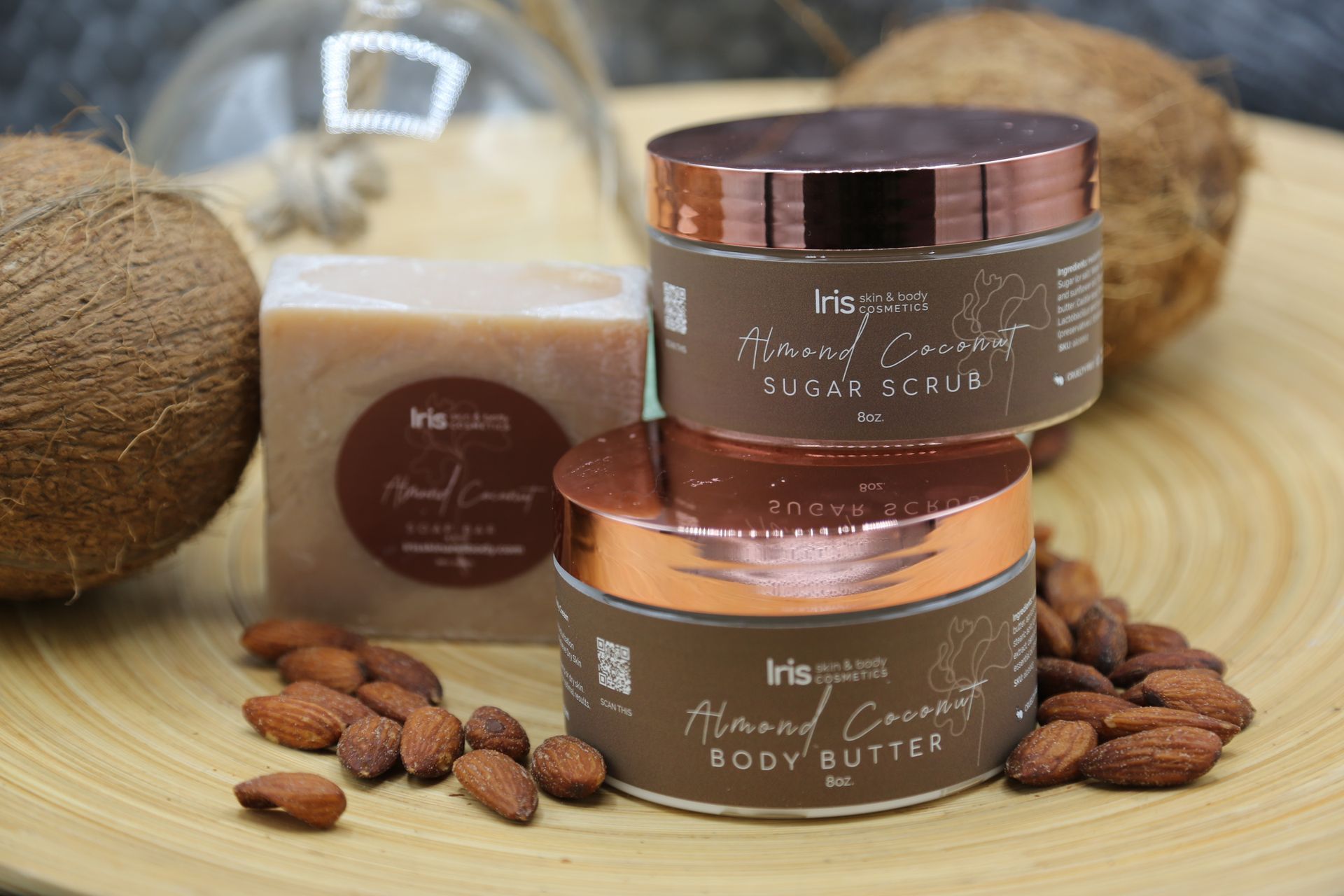 A jar of body butter and a bar of soap are sitting on a wooden table.
