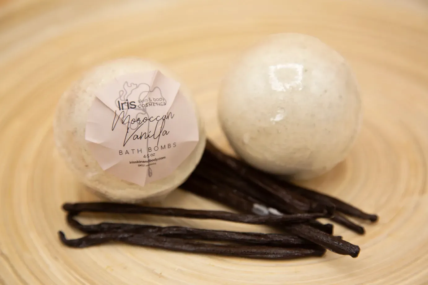 Two bath bombs with vanilla next to it