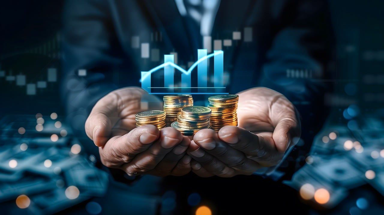 Investor with his hands holding money earned in the stock market.