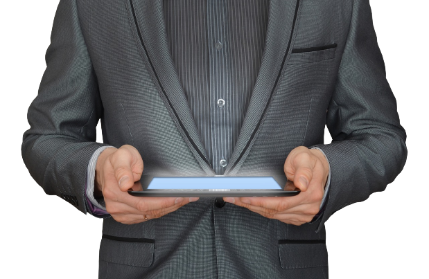 Image of a businessman looking into a computer tablet.