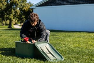 Newport Propane technician servicing a residential propane tank