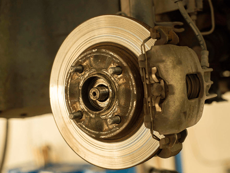 A close up of a brake disc on a car.