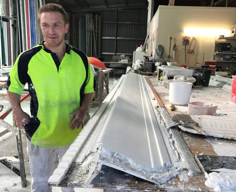 Worker Making Custom Cornice Design — Manufacturing Cornices in Logan Village, QLD