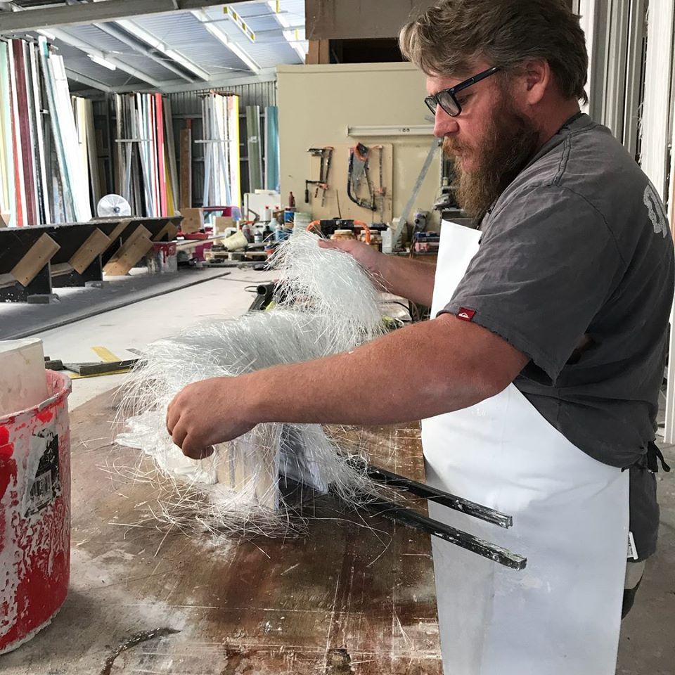 Worker Making Curved Cornice — Manufacturing Cornices in Logan Village, QLD