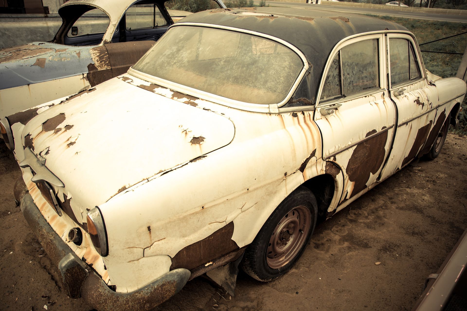 A rusty car with a black roof | Junk Car Buyers in West Allis, WI | Ace Auto Salvage