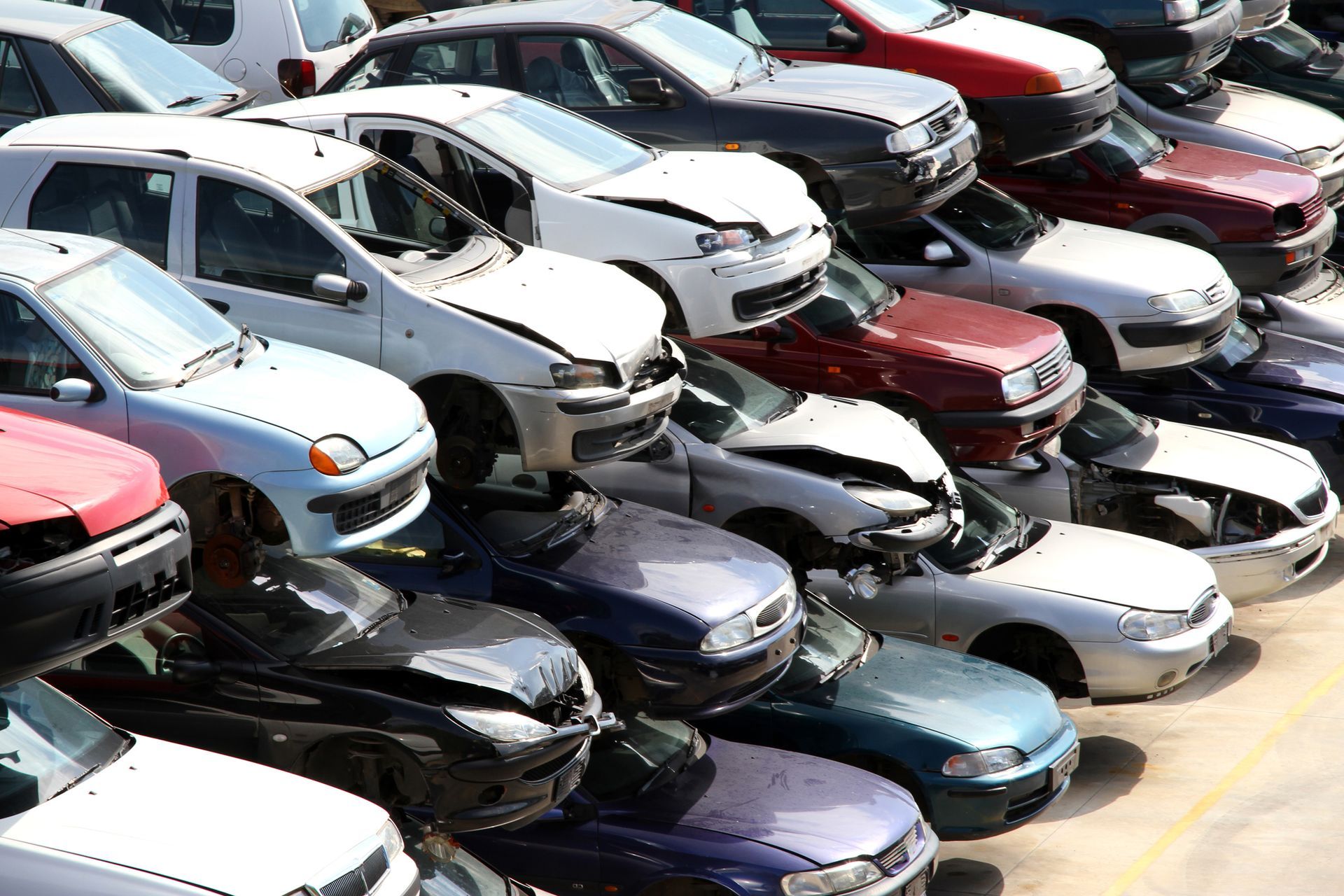 A pile of junk cars at Ace Auto Salvage in New Berlin, WI, where we buy junk cars for top dollar wit