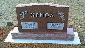 A granite headstone for the Genoa family, featuring carved rose designs and two engraved plaques for Donald and Sharon.