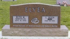 A tan granite tombstone engraved with 