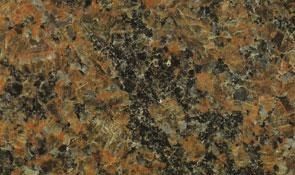 A close-up of speckled granite stone with a mix of orange, brown, grey, and black flecks.
