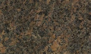 Close-up of polished granite stone with a speckled, mottled pattern in shades of dark brown, black, and tan.