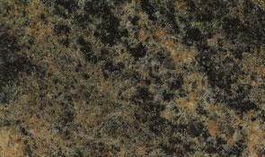 A close-up of a speckled granite surface featuring a mix of black, dark green, and tan mineral patterns.