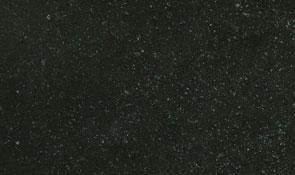 Dark grey stone surface with subtle white speckles and a matte, textured finish.