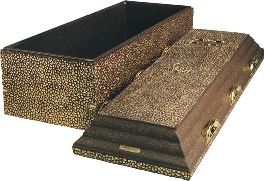 A rectangular, wood-grained casket with a textured, metallic-gold lid and matching panels, shown with the lid off.