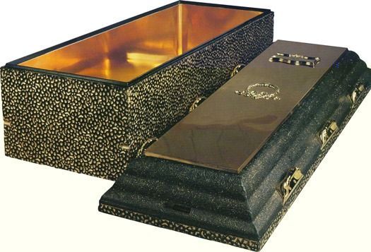 A black coffin with a textured exterior and a gold-colored interior, shown with its lid detached and lying next to it.