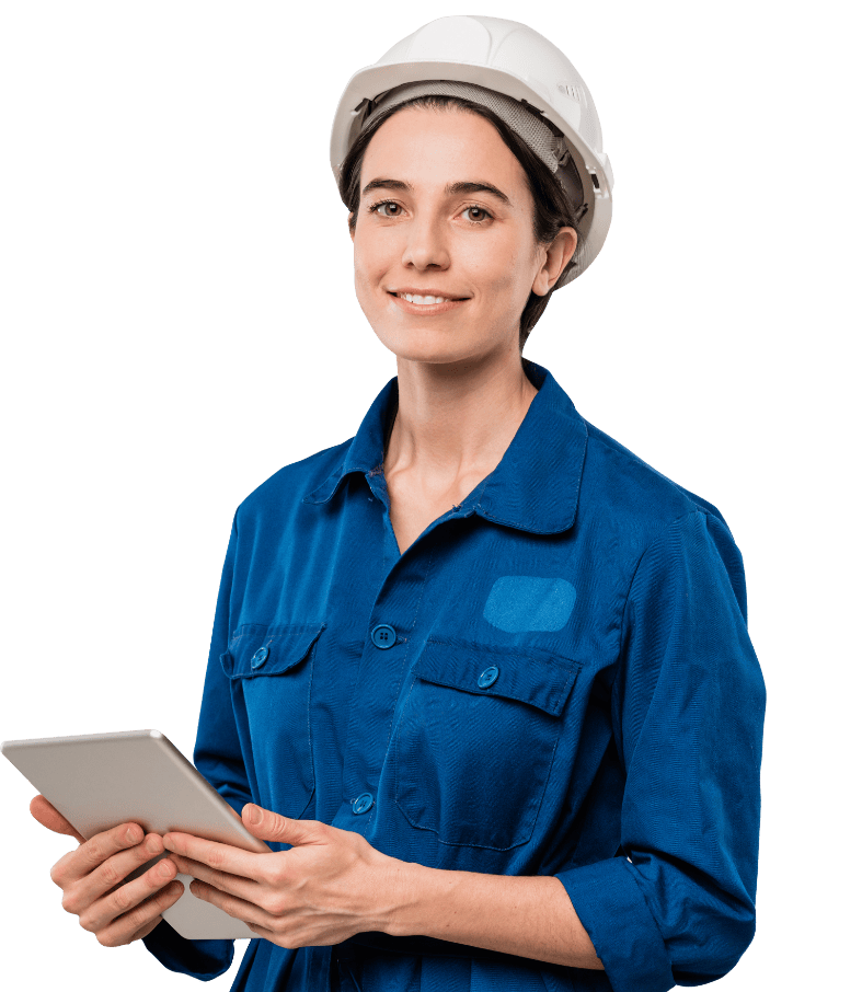 Woman in blue work suit and hard hat, holding a tablet, smiling.