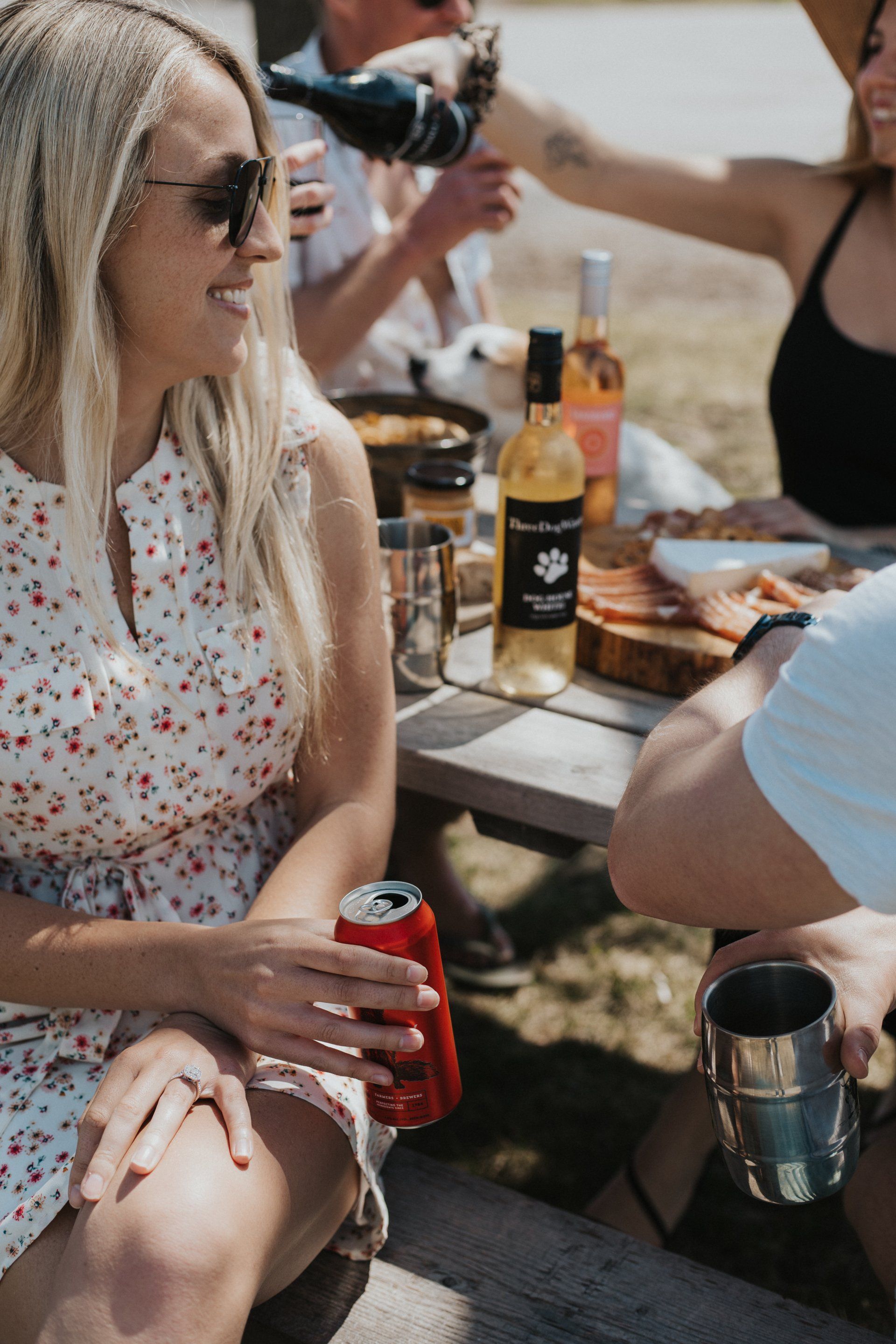 Blonde woman drinking a craft beer in Prince Edward County