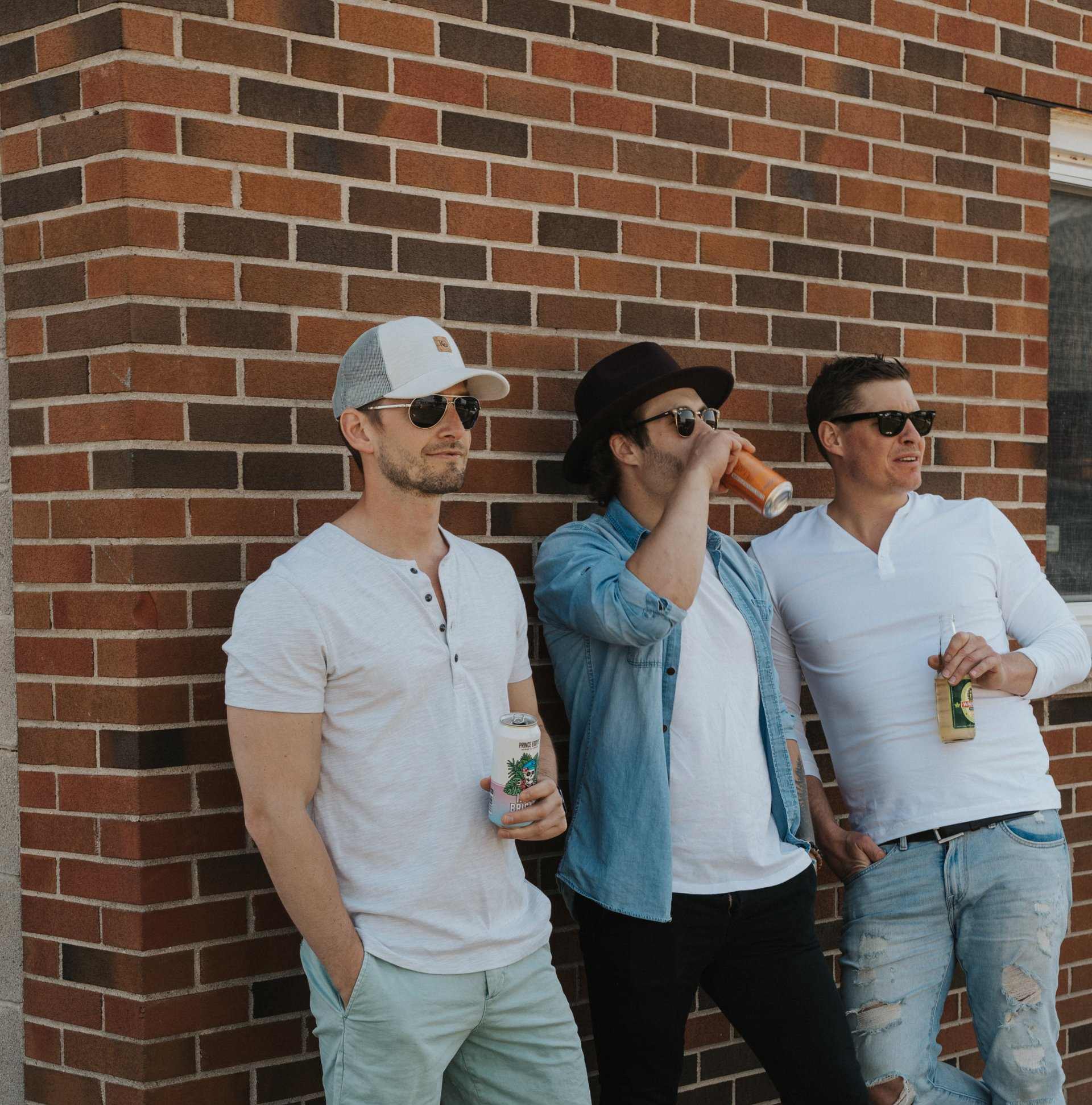 Three men drinking local craft beers