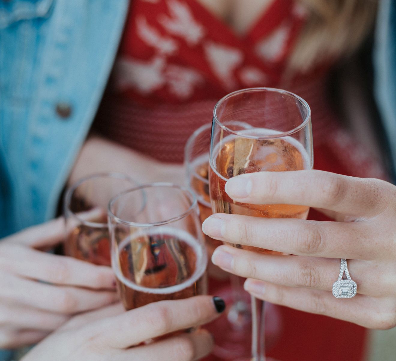 A group having fun celebrating PEC tour with champagne