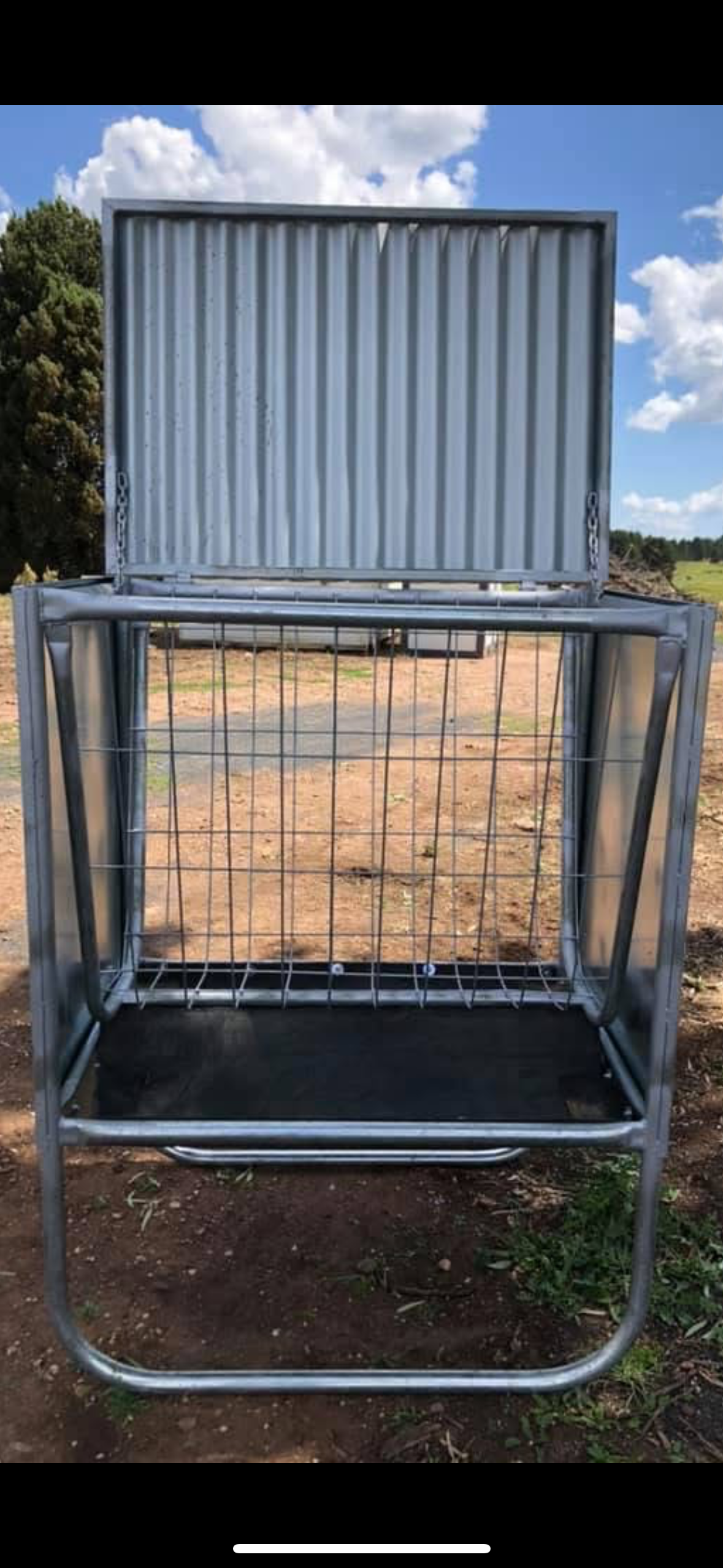 A Metal Cage Is Sitting on The Ground in A Field — Ballimore Welding in Ballimore, NSW
