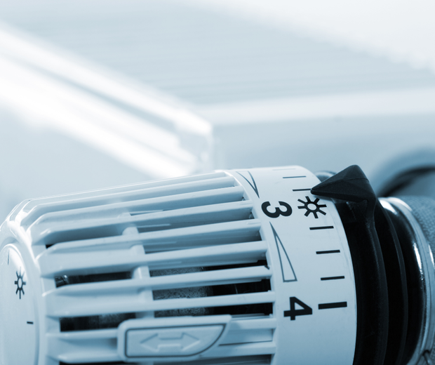 A close up of a thermostat with the number 3 on it