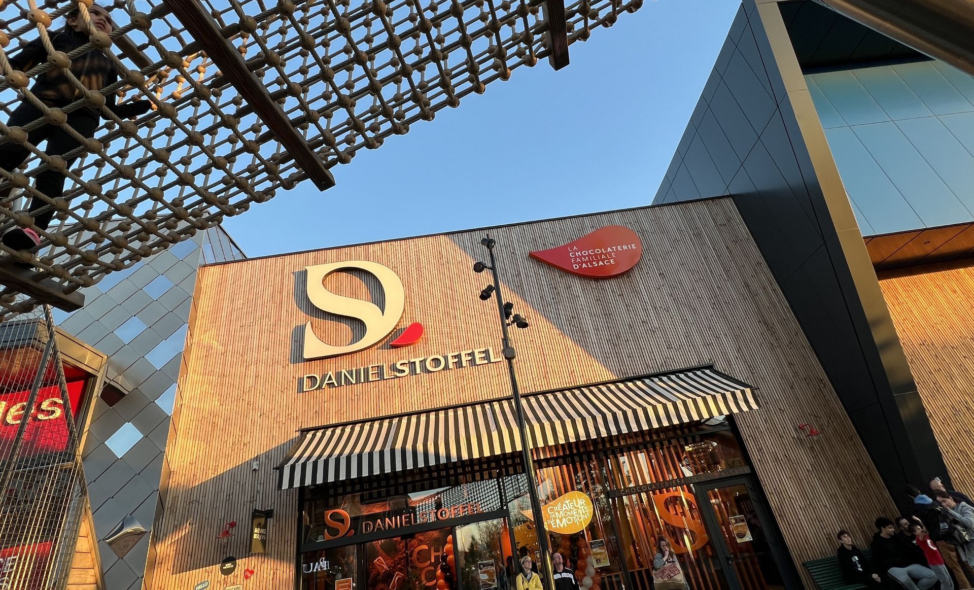 Exterior of a store with a wooden facade, large 