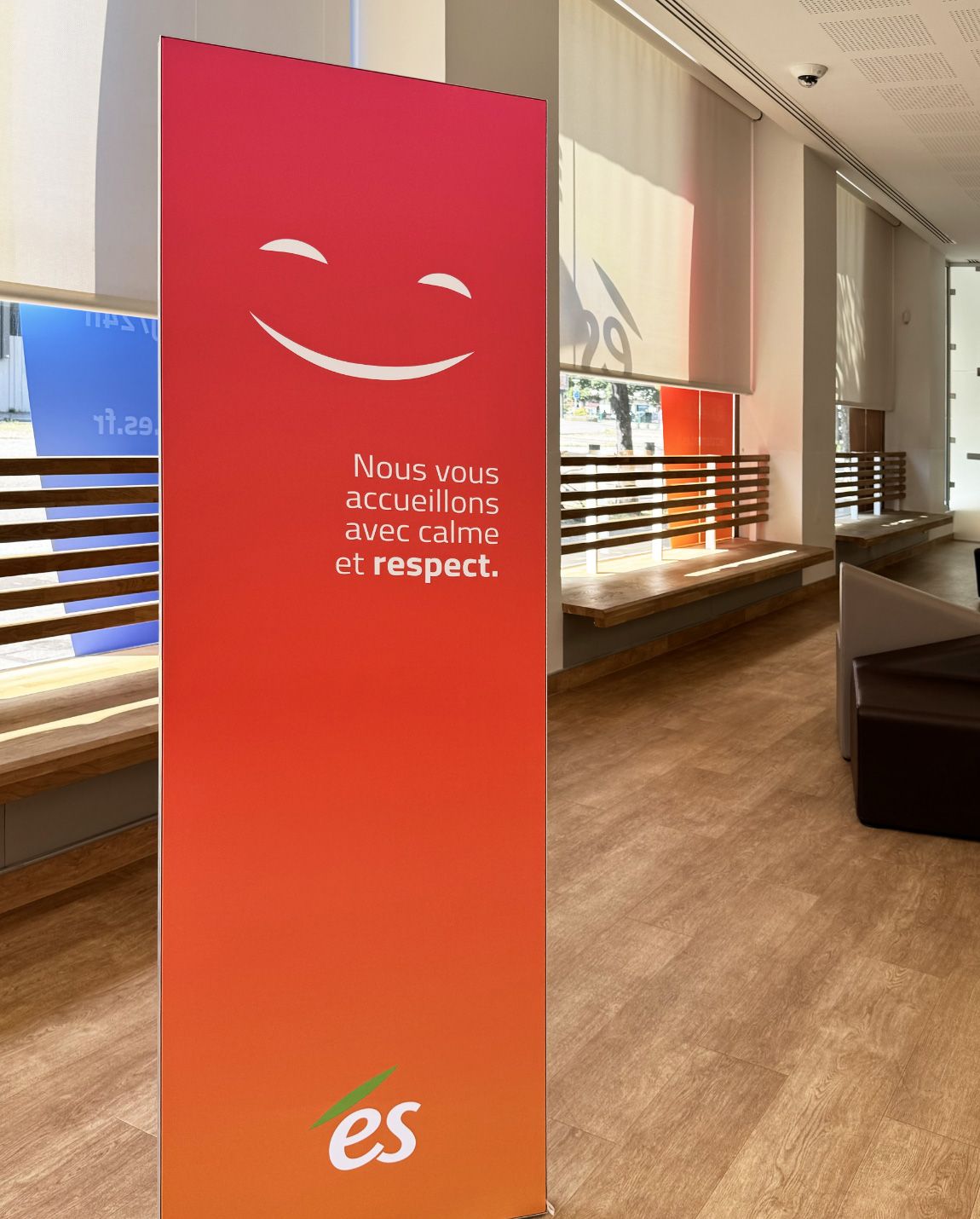 Banner in a store with a smiling face and text 
