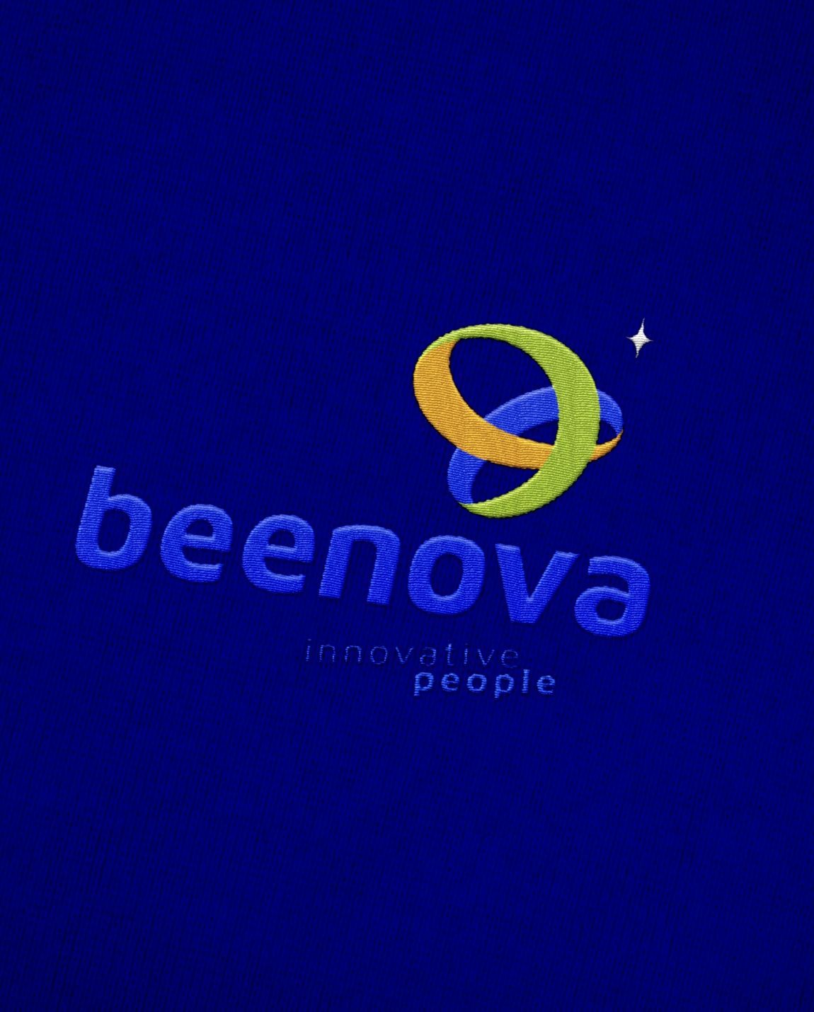 Embroidered beenova logo on blue fabric.