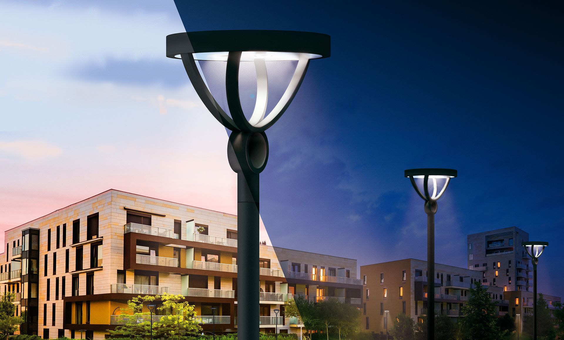 Streetlights illuminate modern buildings; daylight fades to night.