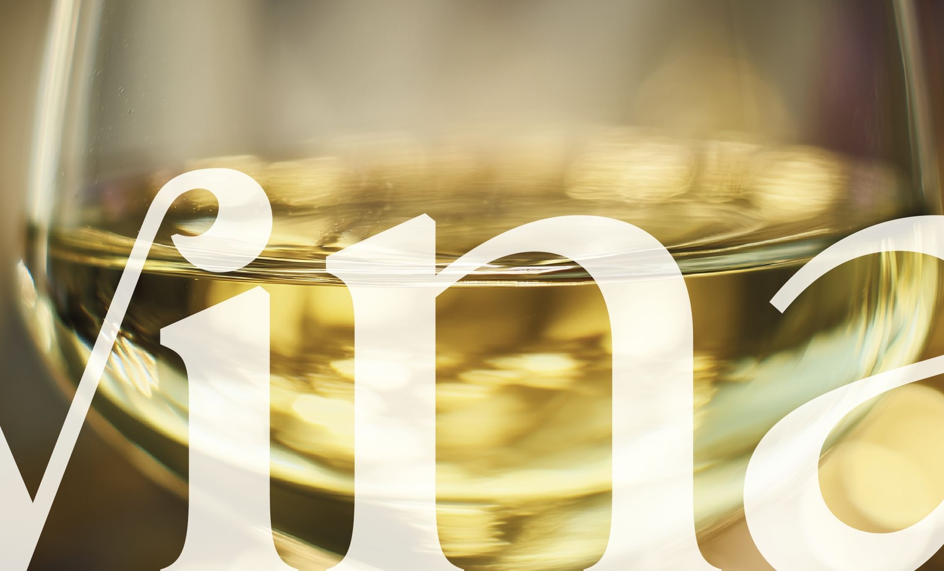 Close-up of a wine glass filled with white wine;