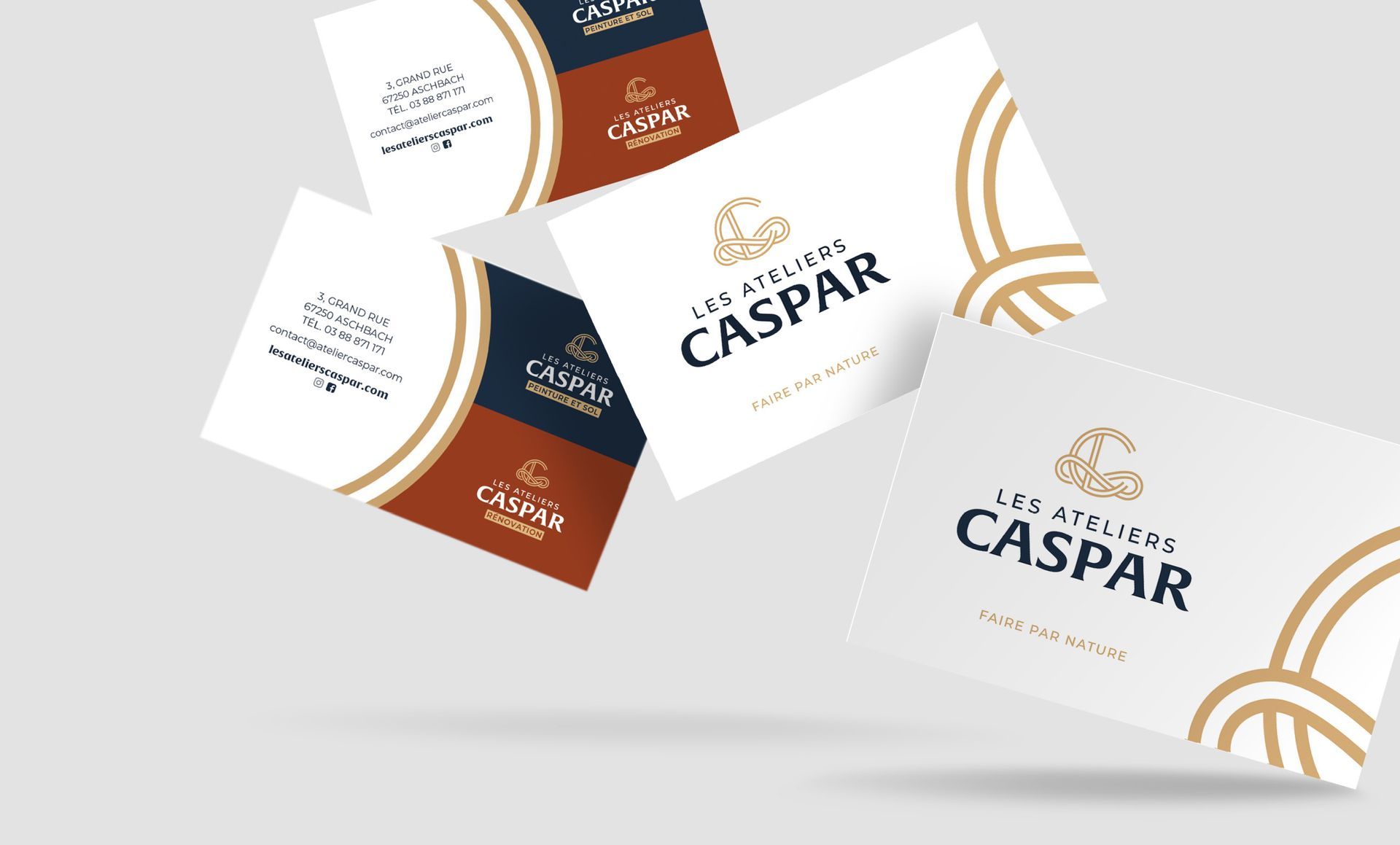 Business cards with the Caspar logo in various orientations, featuring gold, navy blue, and brown accents.