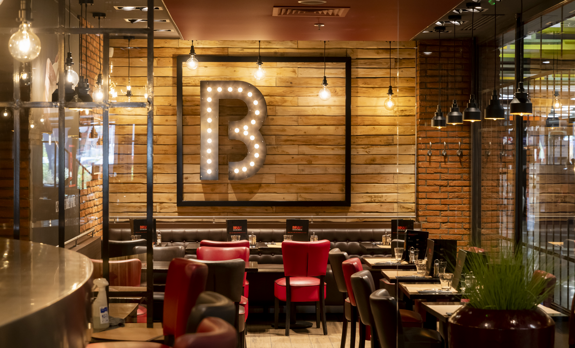 Restaurant interior with wooden wall, lit-up