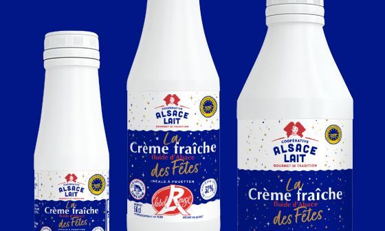 Three white bottles of Alsace Lait Crème fraîche with blue and red label accents.