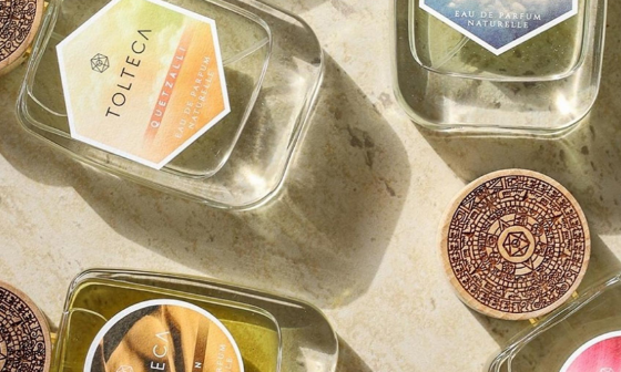 Overhead shot of Tolteca perfume bottles and lids on a light-colored surface.