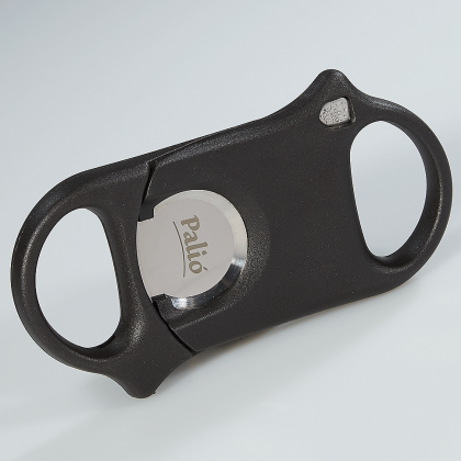 Black oval bottle opener with silver center cap on a light gray background