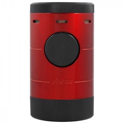 Red cylindrical device with black top and bottom, featuring a large central black button.