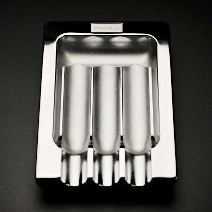 Stainless steel multi-slot tool or utensil holder on a black background