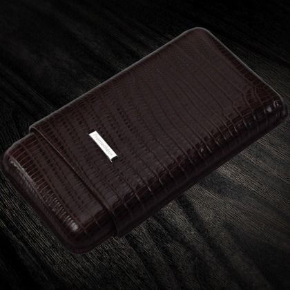 Dark brown leather wallet with a textured surface on a dark background