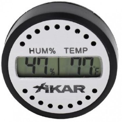 Round white digital humidity and temperature gauge showing 47% humidity and 77°F.