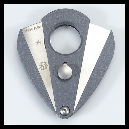 Silver and gray metal nautical tool with circular opening and textured grip on a white background