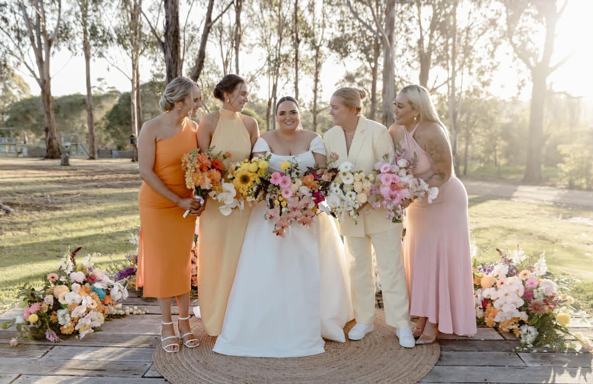 Bridesmaids matching but not matching colours and outfits